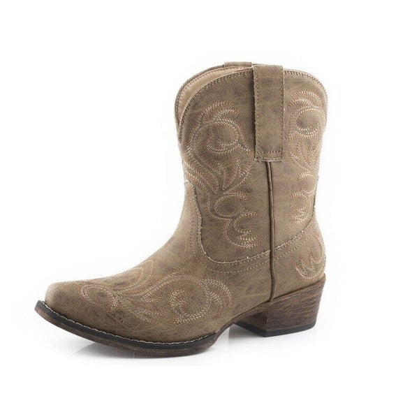 Left side view of a tan faux leather shorty boot with a snip toe, a 1 1/2 inch heel, and embroidered design.