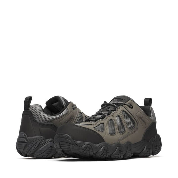 Pair of black and gray lace-up hiking sneakers on a white background