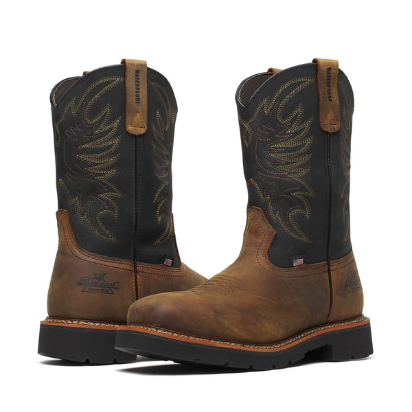 Pair of brown and black cowboy boots on a white background