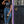 Load image into Gallery viewer, women leaning against doorframe drinking from a mason jar wearing blue jeans and a black crew neck t-shirt that says "Get Dirty"