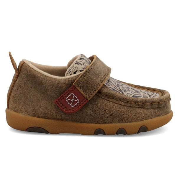 Brown children's moccasin shoe with a strap with design printed on top