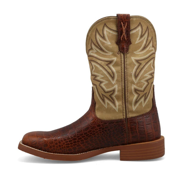 Left side view of brown and beige cowboy boot with intricate stitching upper and alligator print lower on a white background