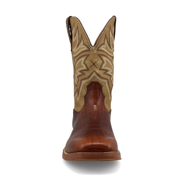 Front view of brown and beige cowboy boot with intricate stitching upper and alligator print lower on a white background