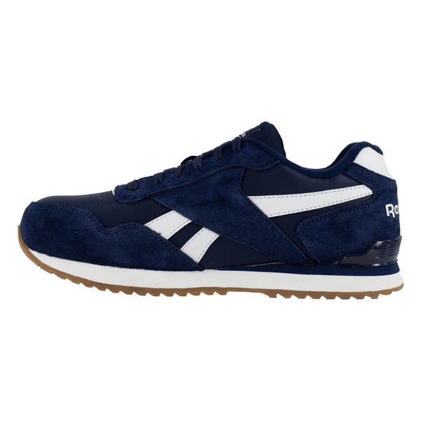 Left side view of a navy blue and white Reebok classic work sneaker with white accents and a rubber outsole on a white background.
