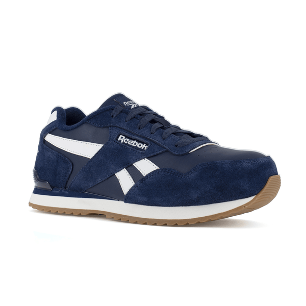 Front angle side view of a navy and white Reebok classic work sneakers with white accents and a rubber outsole.