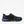 Load image into Gallery viewer, Black athletic lace-up shoe with purple sole and green accents on a white background