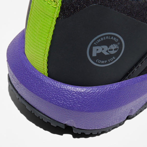 Close-up of a shoe heel and sole with purple midsole and green strap and grey stamped timberland pro logo