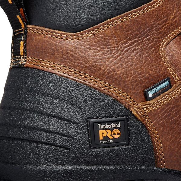 Heel detail of men's brown workboot with black accents and orange timberland pro logo