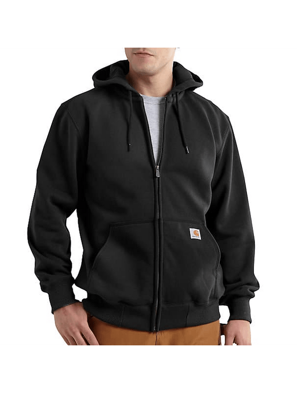 man wearing black hoodie half zipped with tan pants