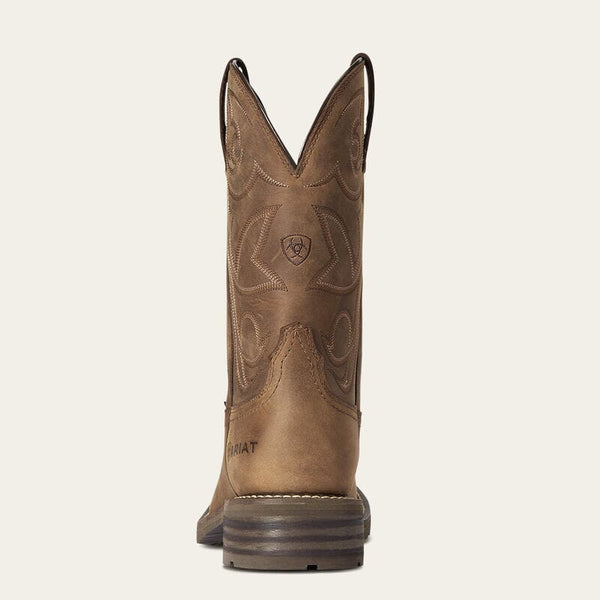 back view of mens brown western boot with light stitching on shaft and Ariat logo stamped on side of heel and back of shaft