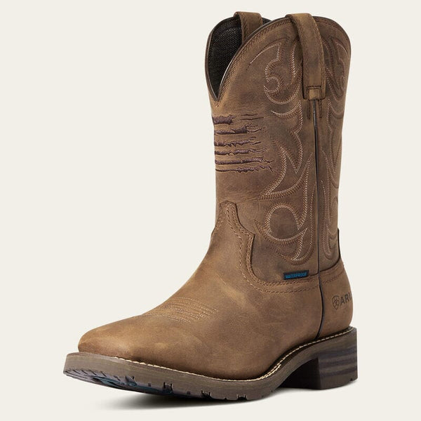 left front view of mens brown western boot with light stitching and american flag embroidered on front of shaft