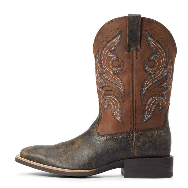 outside view of Two toned brown and black cowboy boots with white and blue embroidery