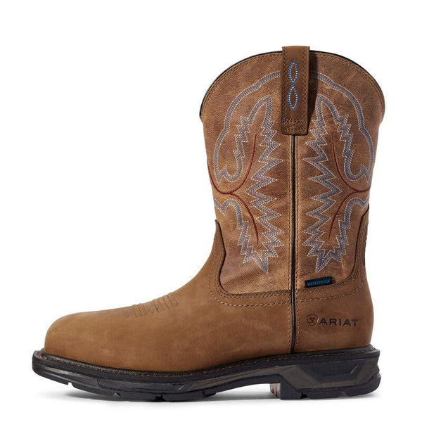 side view of light brown cowboy boot with grey and light blue embroidery and a square toe