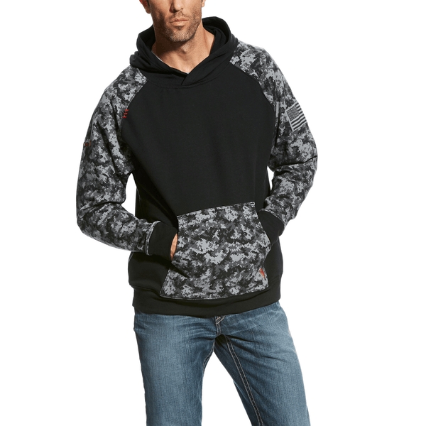 man wearing a black hoodie with a grey and black camo pattern on the sleeves and kangaroo pocket