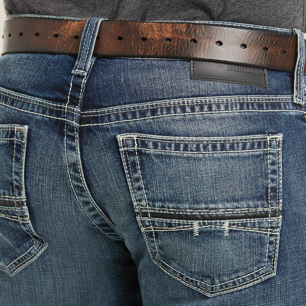 back pocket close up view of man wearing blue jeans with white stitching and a charcoal shirt and brown belt