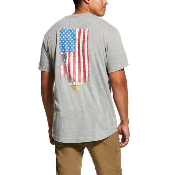 Man wearing grey t-shirt with a distressed American flag on the back