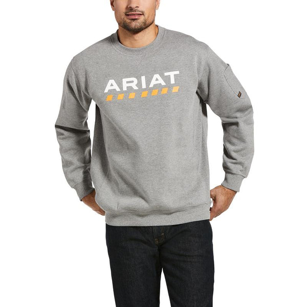 Man wearing grey sweatshirt with Ariat written on the front and a yellow dotted line pattern underneath 