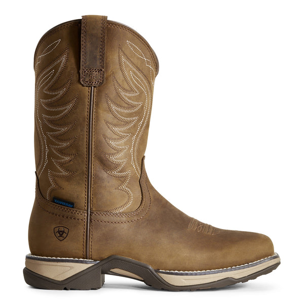 side view of high top pull on light brown work boot with white embroidery