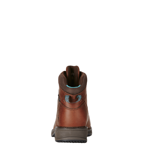 back view of red brown work boot with black sole with blue accents on the pull tab