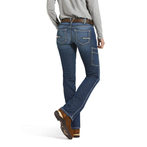 back view of Woman wearing light grey shirt tucked into light blue jeans
