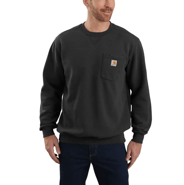 man wearing black crewneck sweatshirt and blue jeans