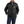 Load image into Gallery viewer, man wearing black insulated jacket and blue jeans with hands in jacket pockets