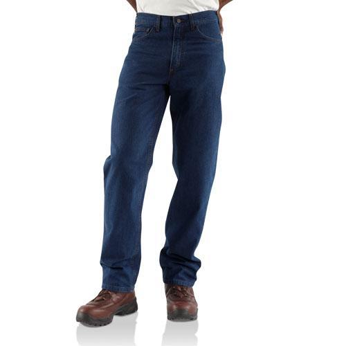 man wearing dark denim jeans and brown boots