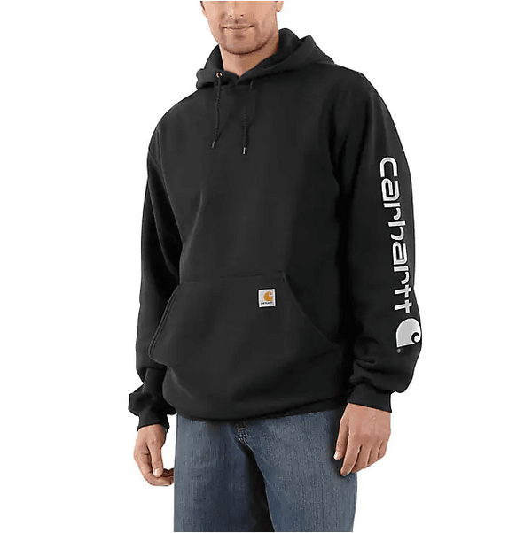man wearing black hoodie with carhartt logo vertically on sleeve