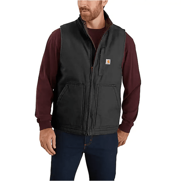 man wearing black Carhartt vest over maroon long sleeve shirt