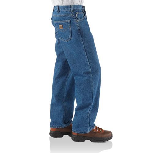side view of man wearing blue jeans with brown boots