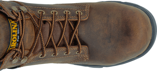 top view of mid top brown suede work boot with black heel and sole
