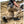 Load image into Gallery viewer, man kneeling in dirt wearing black boots, gun on hip, and holding shooting target