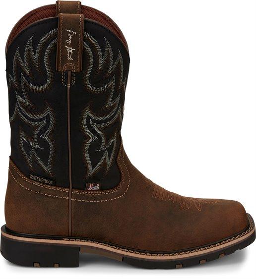 side of cowboy boot with black shaft, brown vamp, and white embroidery 