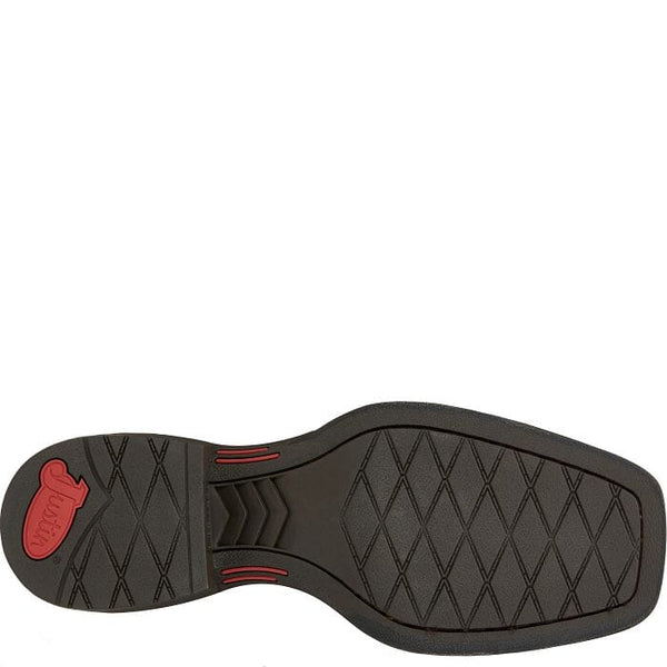 bottom view of black sole on men's wide square toe western boot with Justin logo on heel in red.
