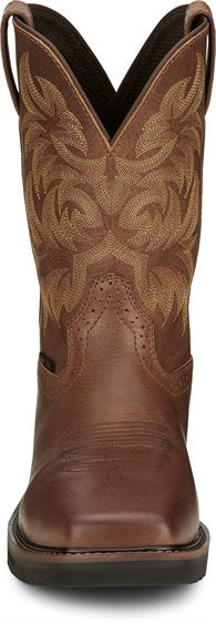 front of brown cowboy boot with light brown embroidery and black sole