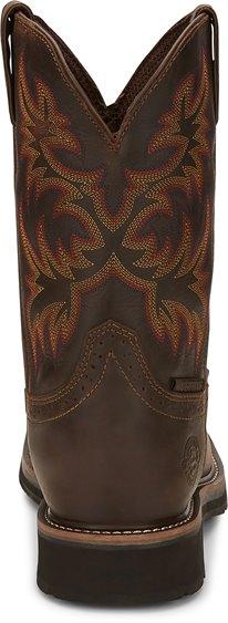 back of dark brown cowboy boot with orange and red embroidery