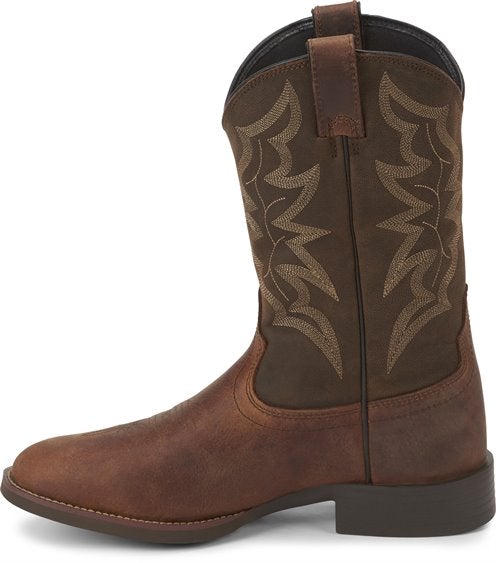 side of cowboy boot with dark brown shaft and light brown vamp and light brown embroidery