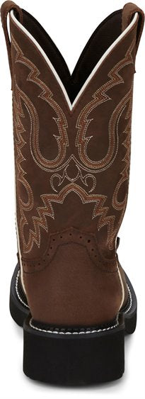 back view of brown traditional round toe cowgirl boot with ivory and rust stitch pattern and white seam accents