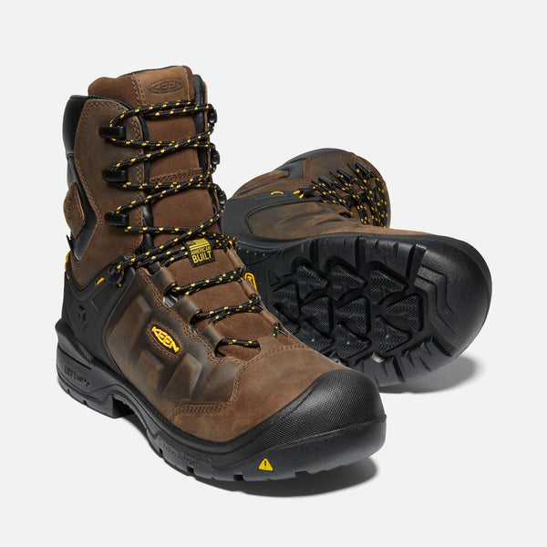 two brown hightop boots with yellow and black laces, black toe guard and sole, black eyelets