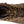 Load image into Gallery viewer, top of brown boot with black toe guard and sole and yellow and brown laces