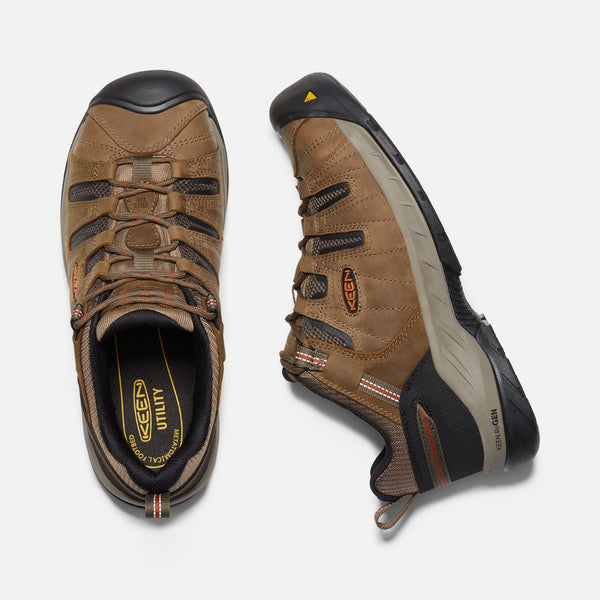 top view and side view of light brown outdoor shoe with black toe guard and brown laces