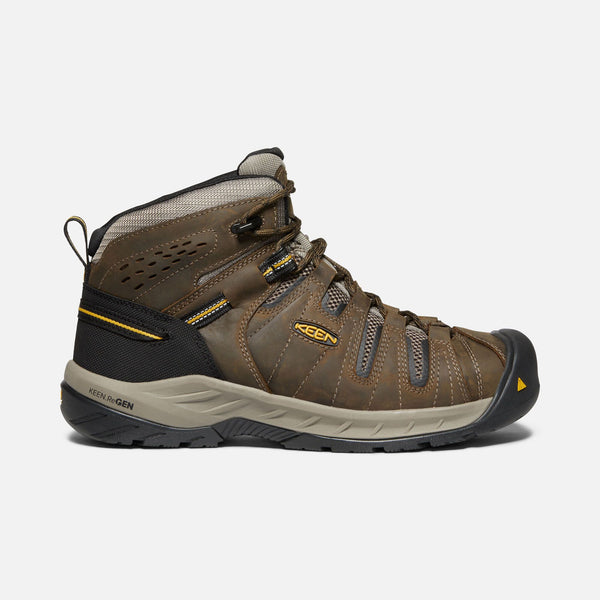 brown outdoor shoe with black toe guard and heel and brown laces