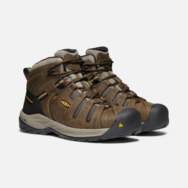brown outdoor shoes with black toe guard and heel and brown laces