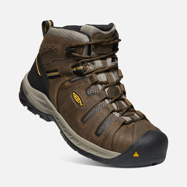 angled view of brown outdoor shoe with black toe guard and heel and brown laces