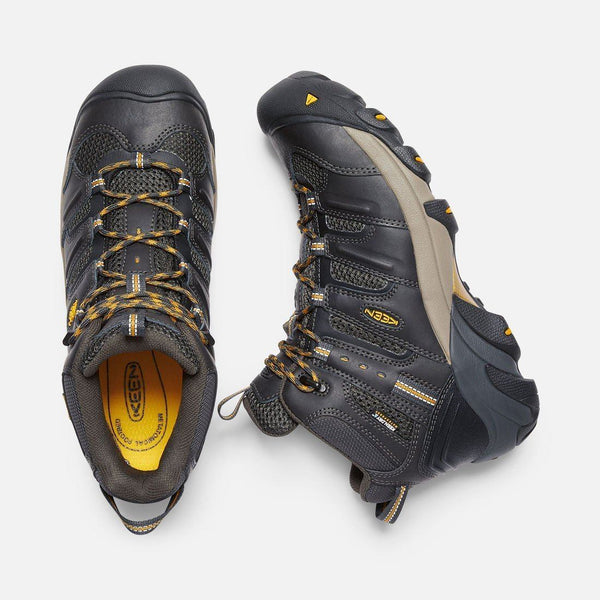 top view and side view of black boot with black and khaki sole and green and khaki laces