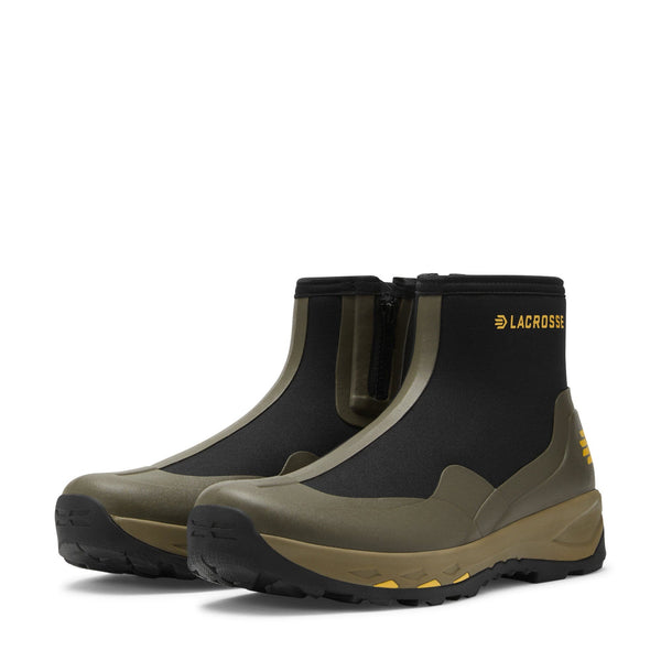 pair of black and olive green low top rubber boots with side zipper and tan soles