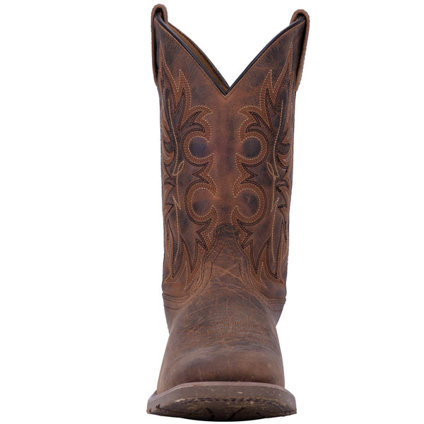front of brown cowboy boot with brown and black embroidery and distressed leather