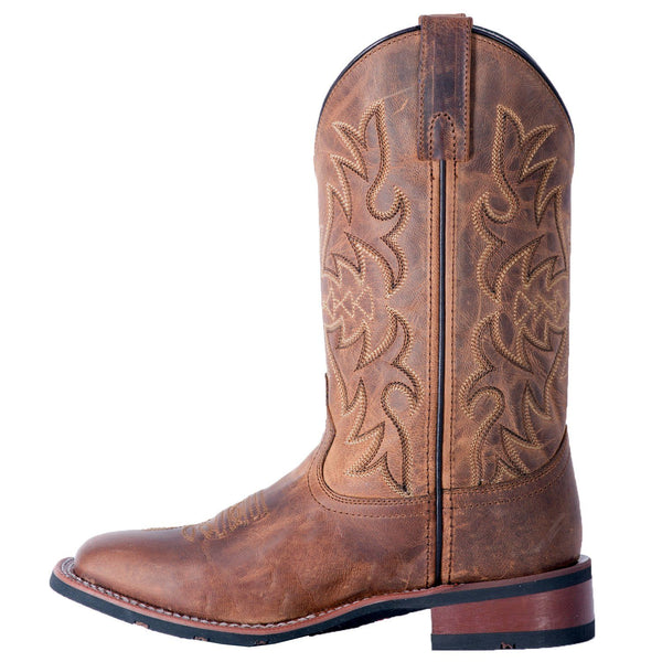 side of brown cowboy boot with light brown embroidery and distressed leather