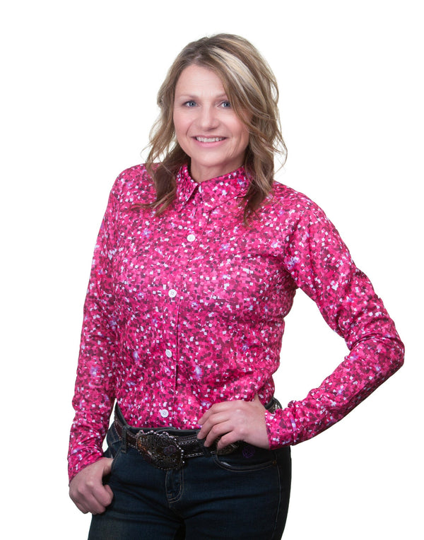 woman wearing pink, fuchsia, and white glitter patterned long sleeve button up shirt.