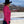 Load image into Gallery viewer, woman outside standing by white wood fence, wearing pink and white glitter pattern shirt and black western hat